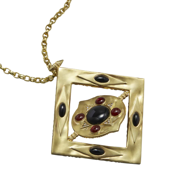 Diamond shaped gold pendant with cabochons.