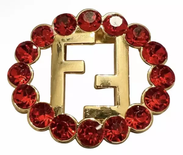 Fendi Gold Toned Logo Brooch with Red Crystal Rhinestones.