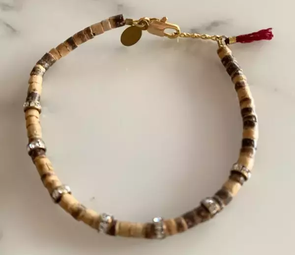 SHASHI Natasha Wooden Bead and Crystal Bracelet with Wine Colored Tassel. SHASHI Natasha Wooden Bead and Crystal Bracelet with Wine Colored Tassel.
