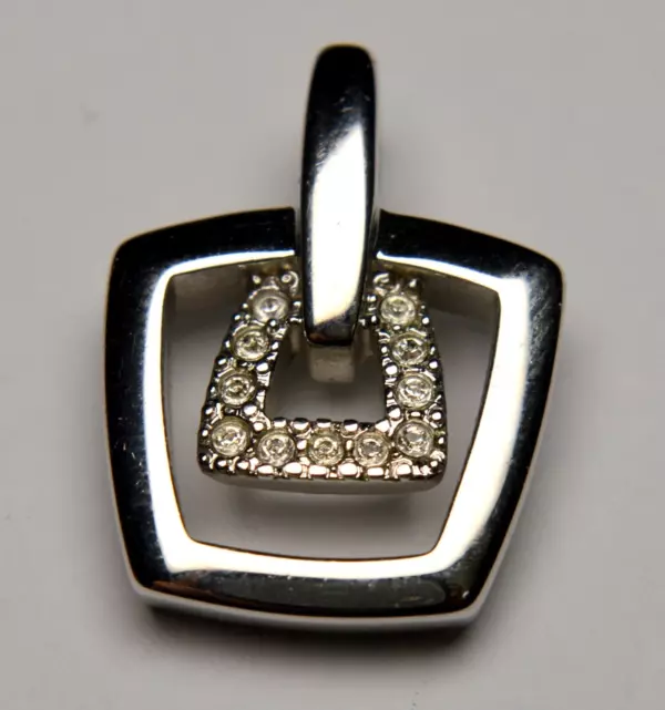 PIERRE LANG BRANDED 18K WHITE GOLD PLATED PENDANT. PIERRE LANG BRANDED 18K WHITE GOLD PLATED PENDANT.